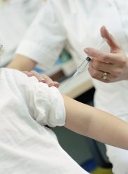 Person getting a shot in the arm