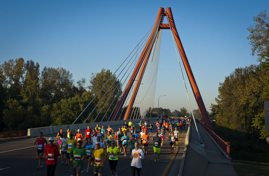 Runners cross Robert N. Stewart bridge in downtown Columbus during the annual Mill Race Marathon
