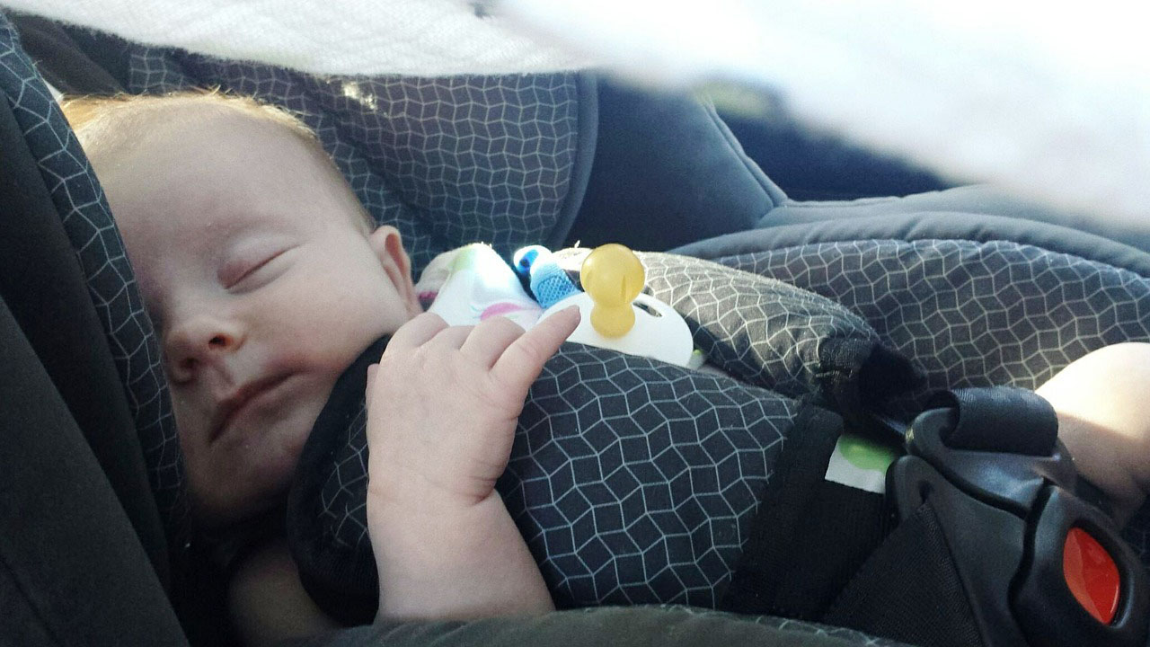 Baby sleeping in a car seat