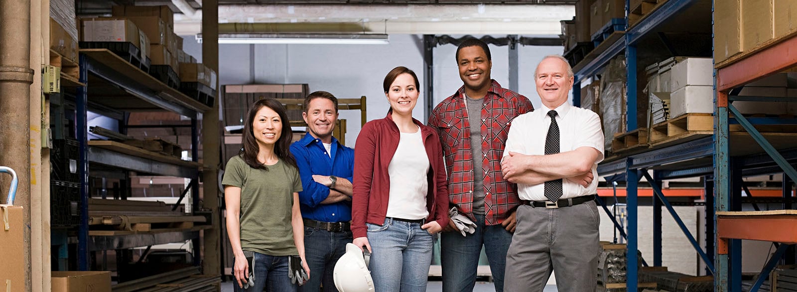 Group photo of workers in a warehouse