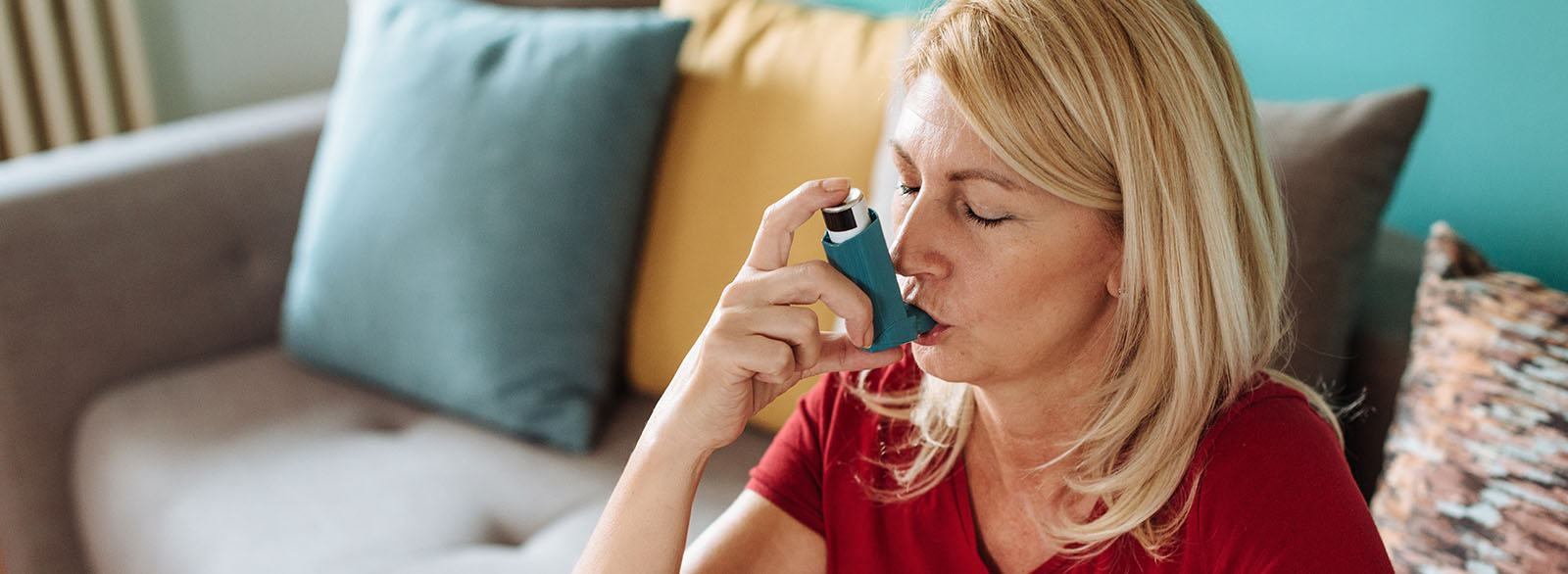 Woman with asthma inhaler