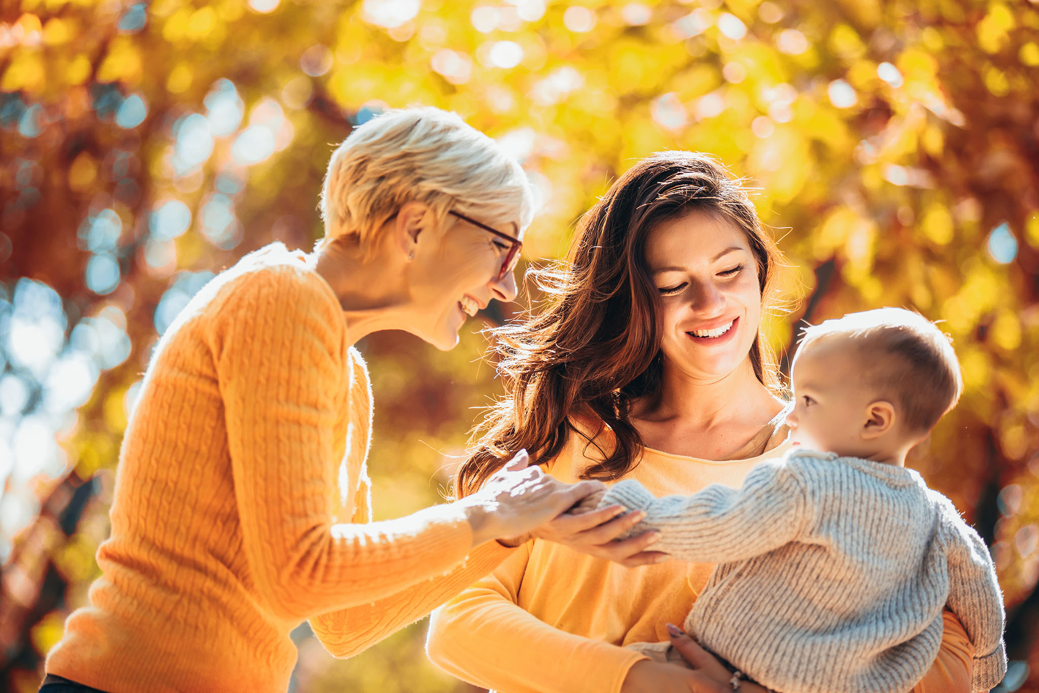 AdobeStock_263736550_blog Grandmother, daughter and granddaughter outside.