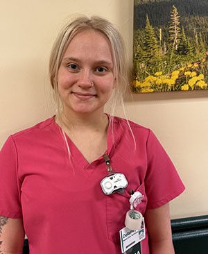 CRH nurse wearing wearable panic button.