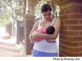 Mother breastfeeding her infant child