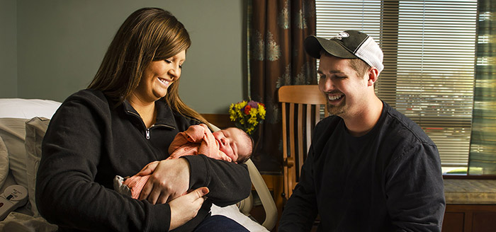 Mother and father with newborn at CRH Birthing Center