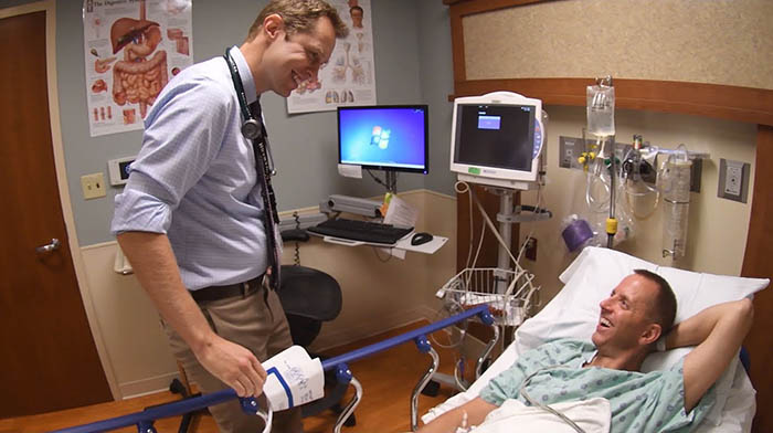 Patrick Barrett MD speaks with colonoscopy patient Brad Davis.