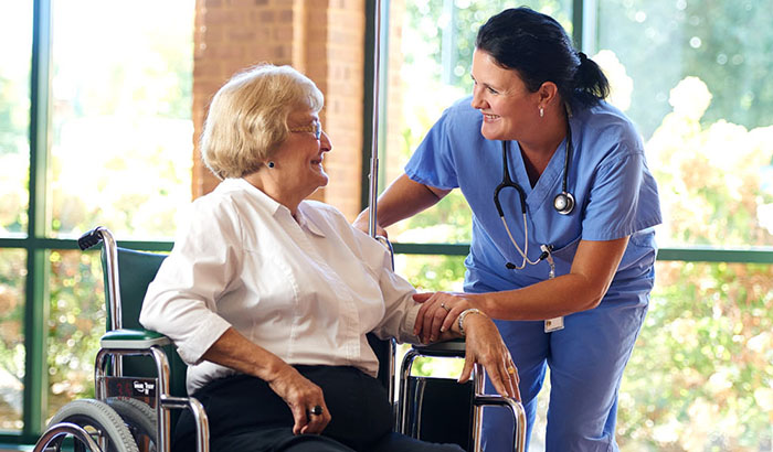 Nurse with patient in wheelchair