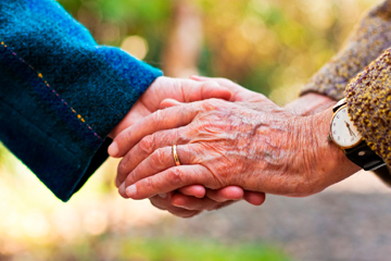 Close up of hands clasped