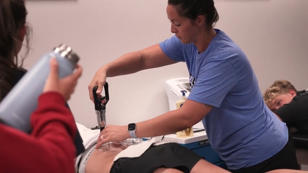 crh-athletic-trainers CRH athletic trainer tending to an athlete.