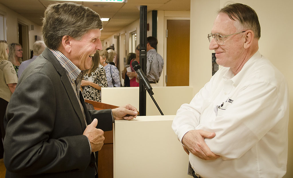 Zack Ellison, left, and David Doup chat at the VIMCare Open House.