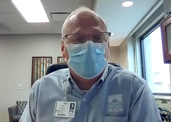 CEO Jim Bickel wearing surgical mask.
