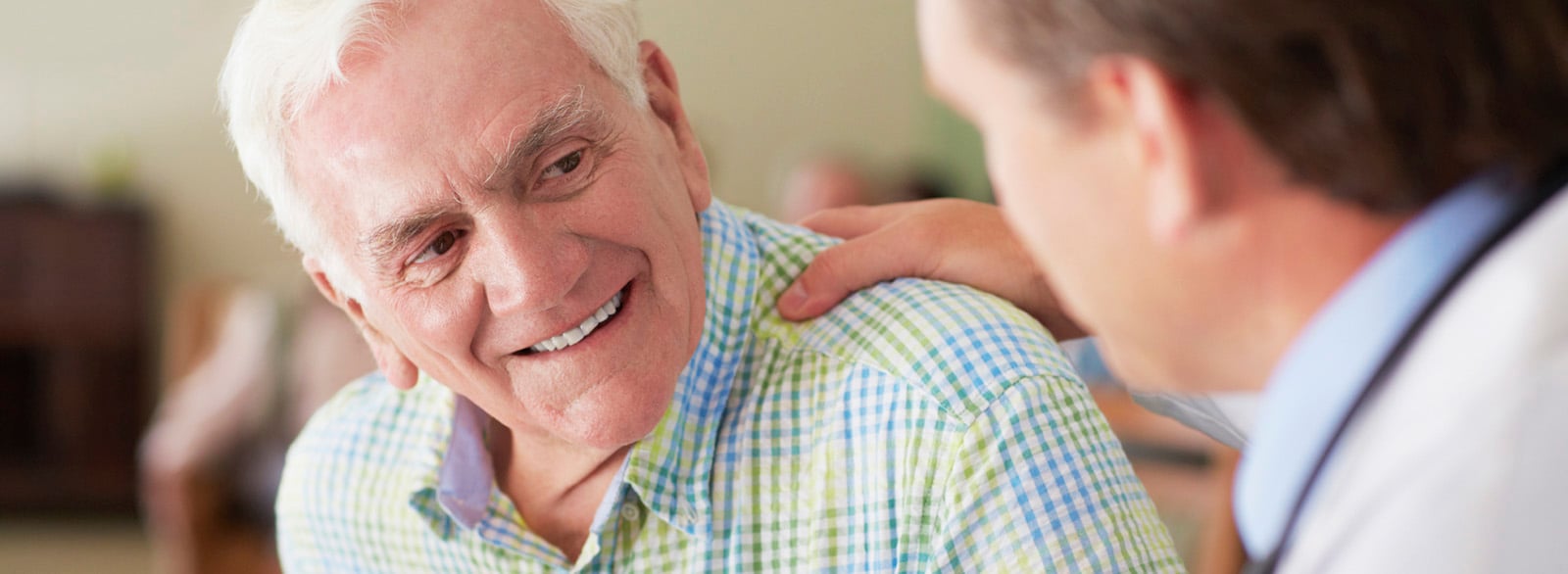 Physician with elderly male patient